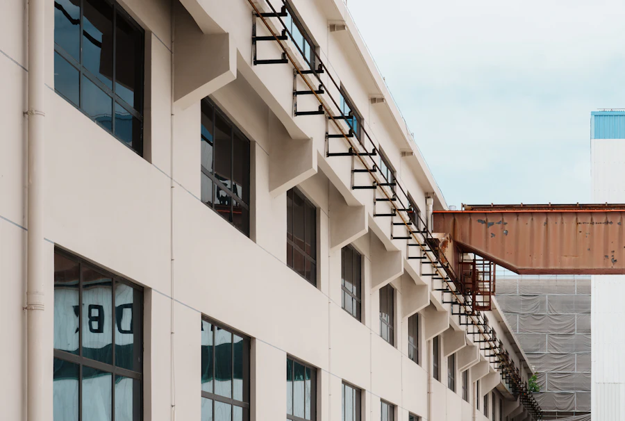 Converted brick-and-render factory building with steel fire escapes